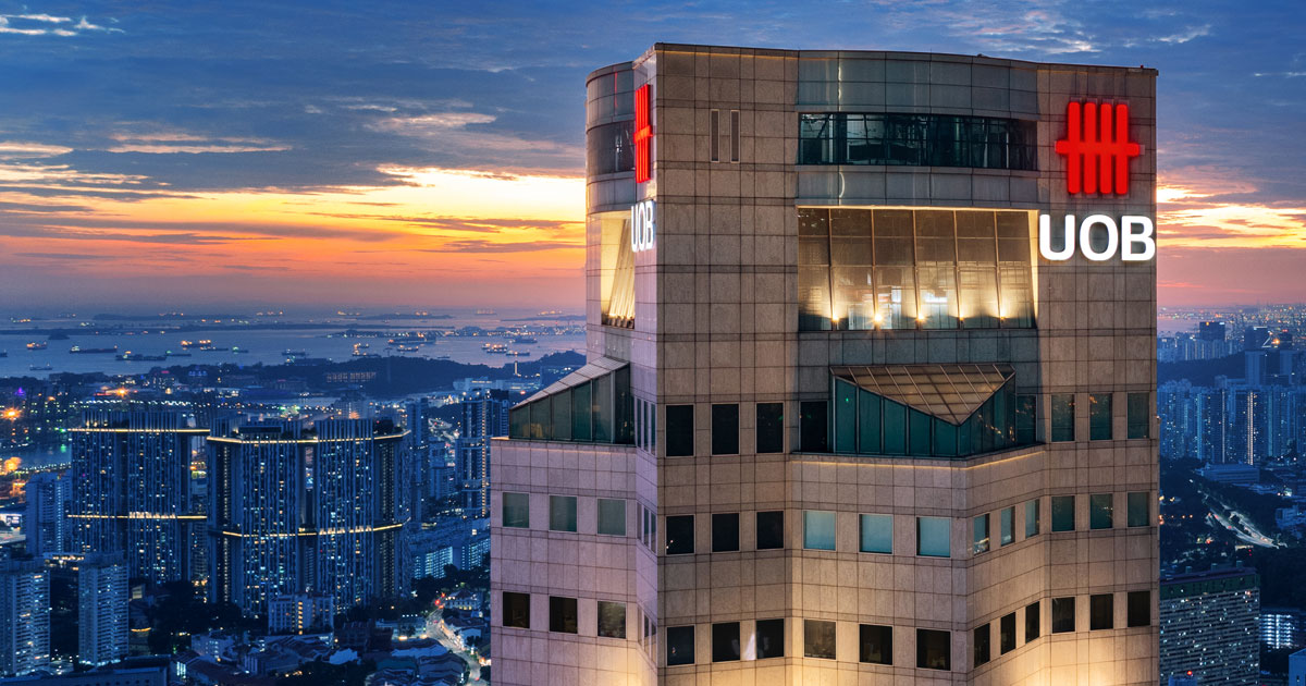 UOB headquarters tower lit at dusk above the city skyline